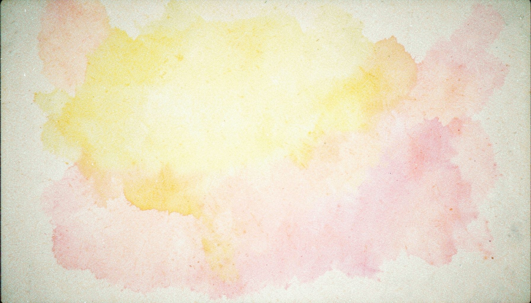 A grainy analog film photograph of a soft pastel yellow and pink abstract wash, like faded watercolor on textured paper, gentle and airy.